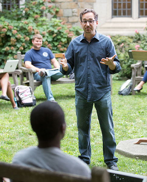 Students listen to a lecture on the Law Quad